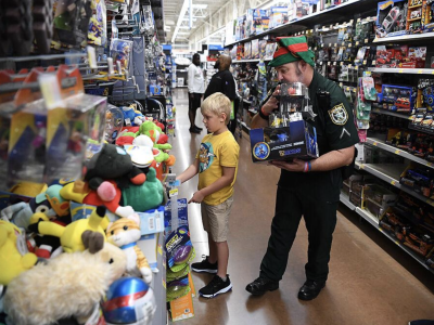 Shopping with cops brings smiles to kids