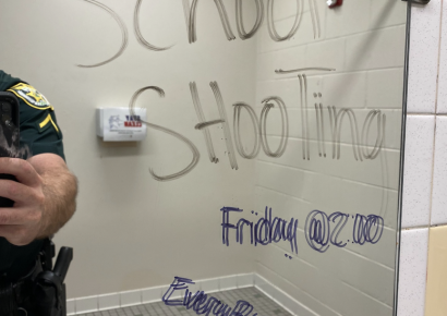 Threatening message in middle school bathroom leads to two arrests